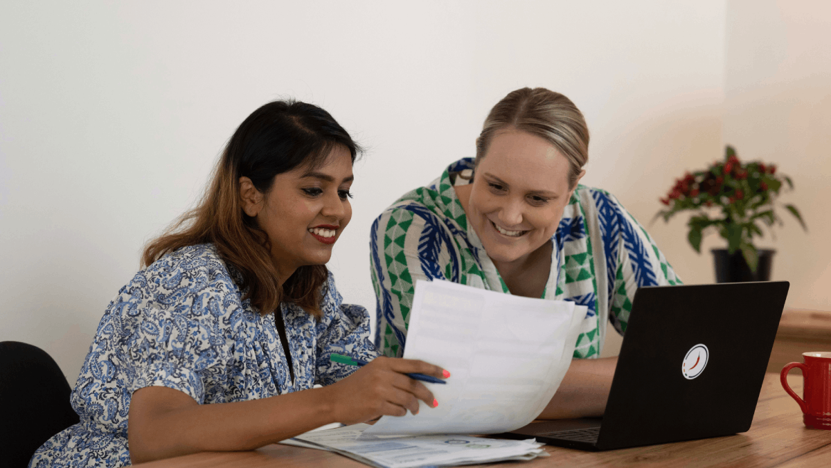 two women looking at Pepper Money's fixed interest rates fact sheet