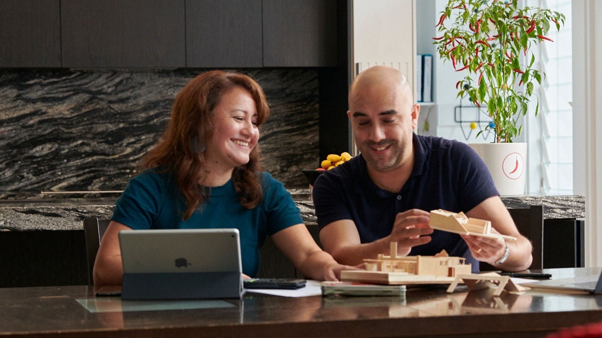 Couple discuss paperwork and refinancing loans