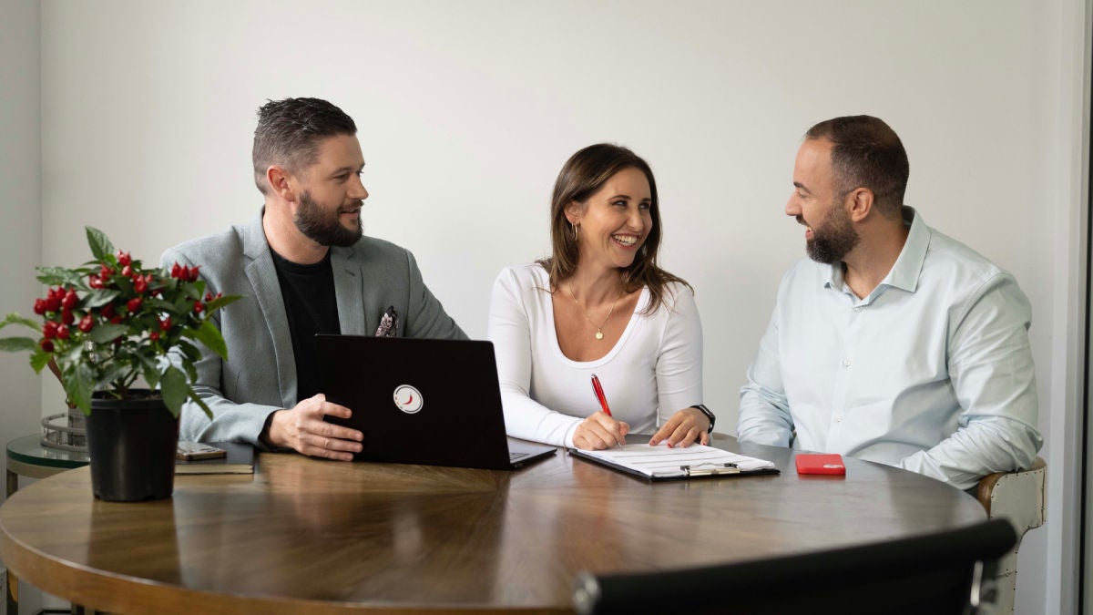 couple signing their home loan contract