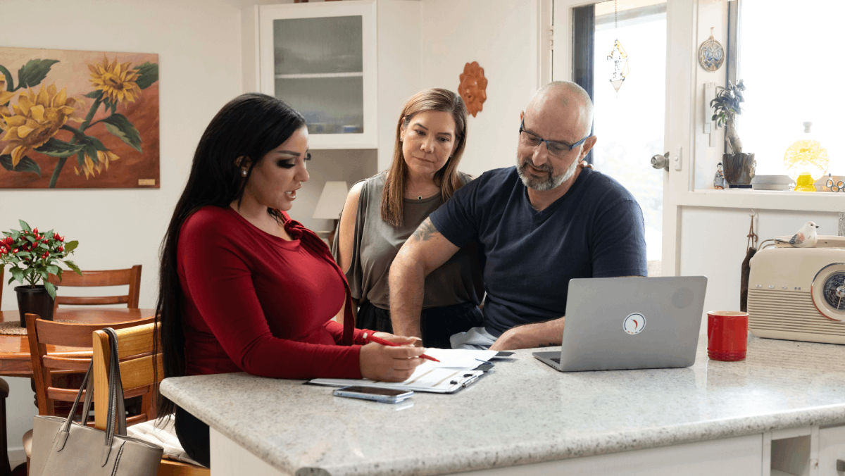broker explaining what stamp duty is to a couple