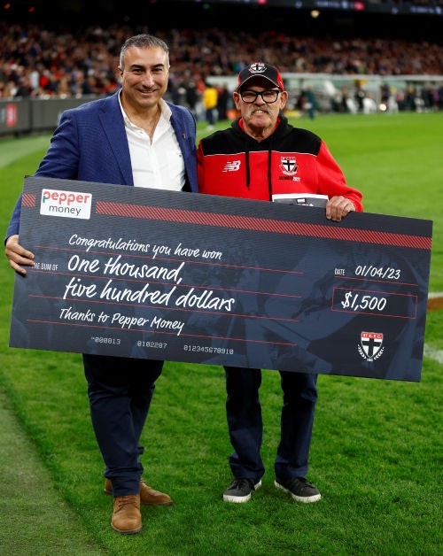 Pepper Money CEO Mario Rehayem poses with winning Saints fan